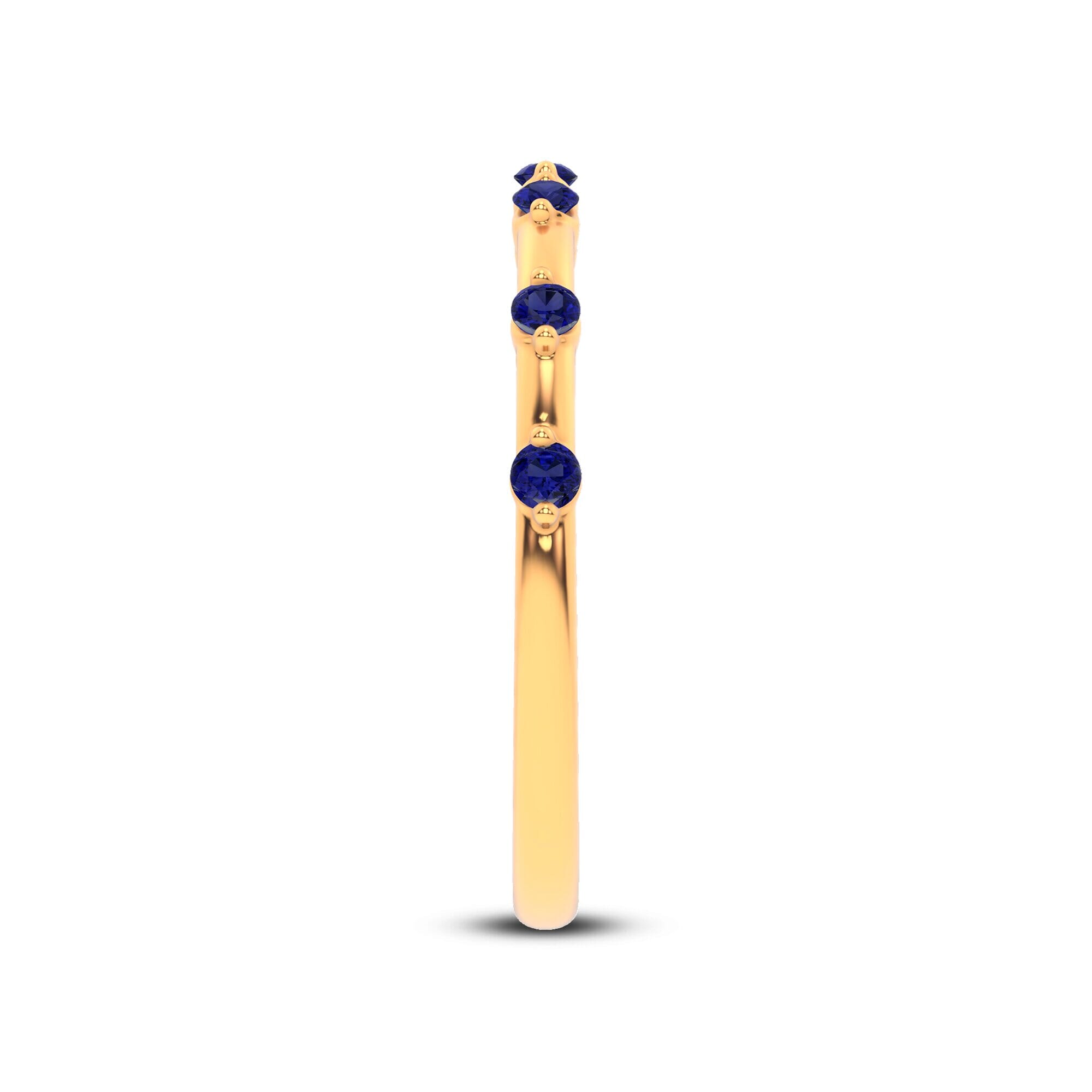 18K Yellow Gold Starlight Spaced Blue Sapphire Band