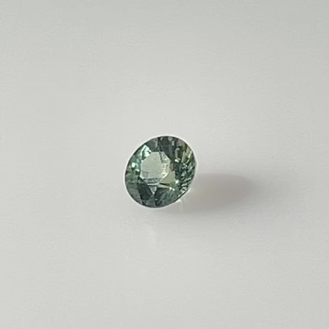 0.58 Carat Teal Round Sapphire