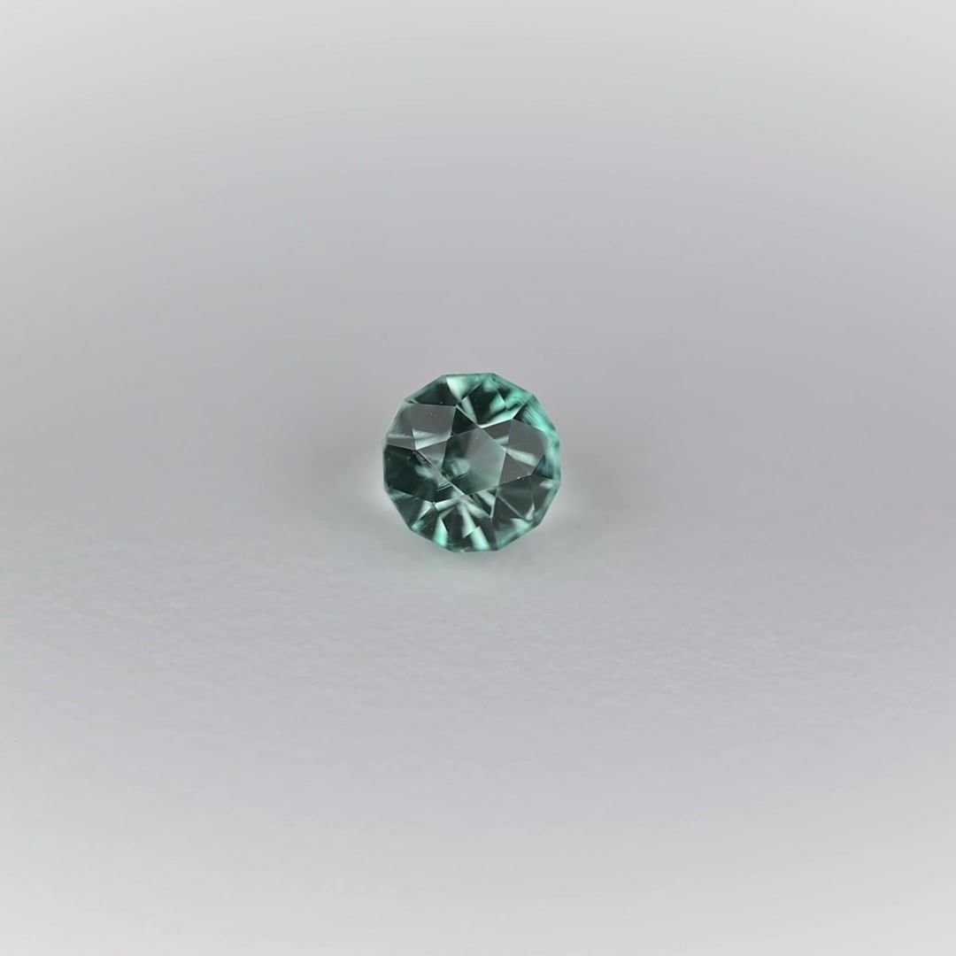 0.49 Carat Light Green Round Emerald
