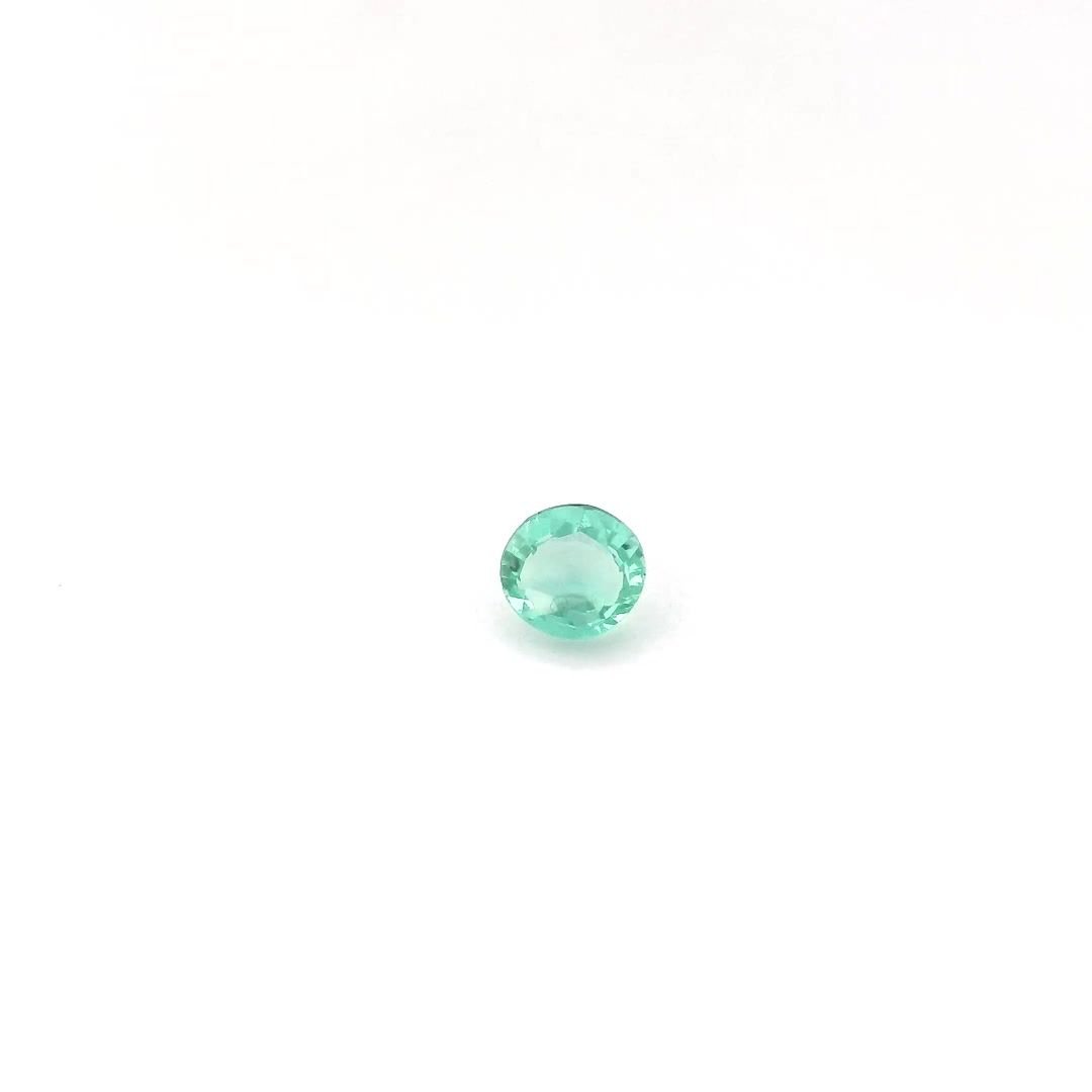 0.33 Carat Light Green Round Emerald