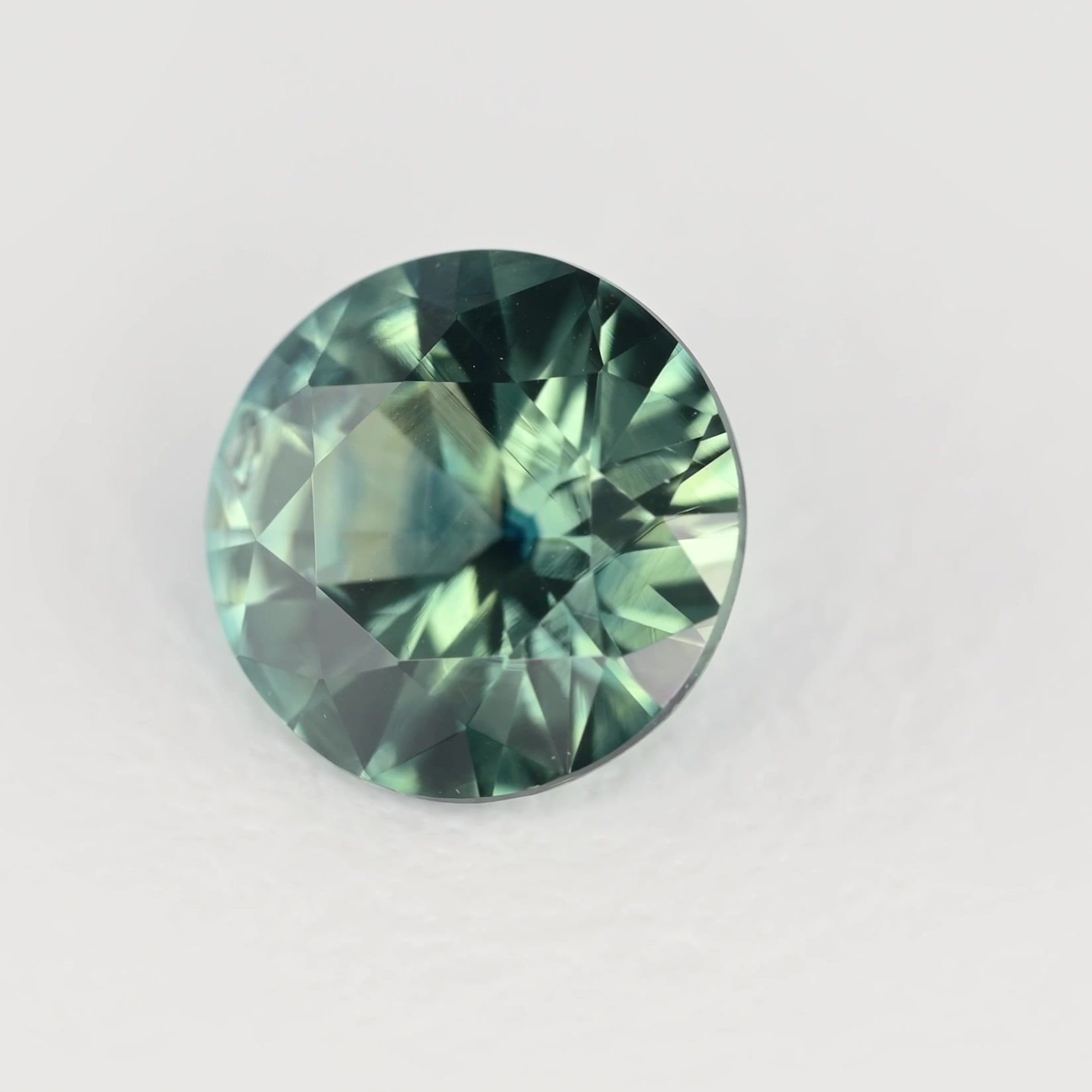 0.62 Carat Teal Round Sapphire
