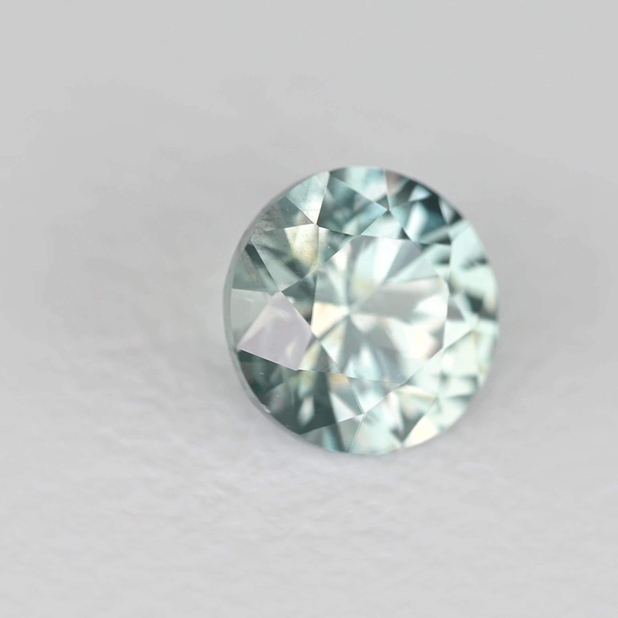 0.65 Carat Teal Round Sapphire