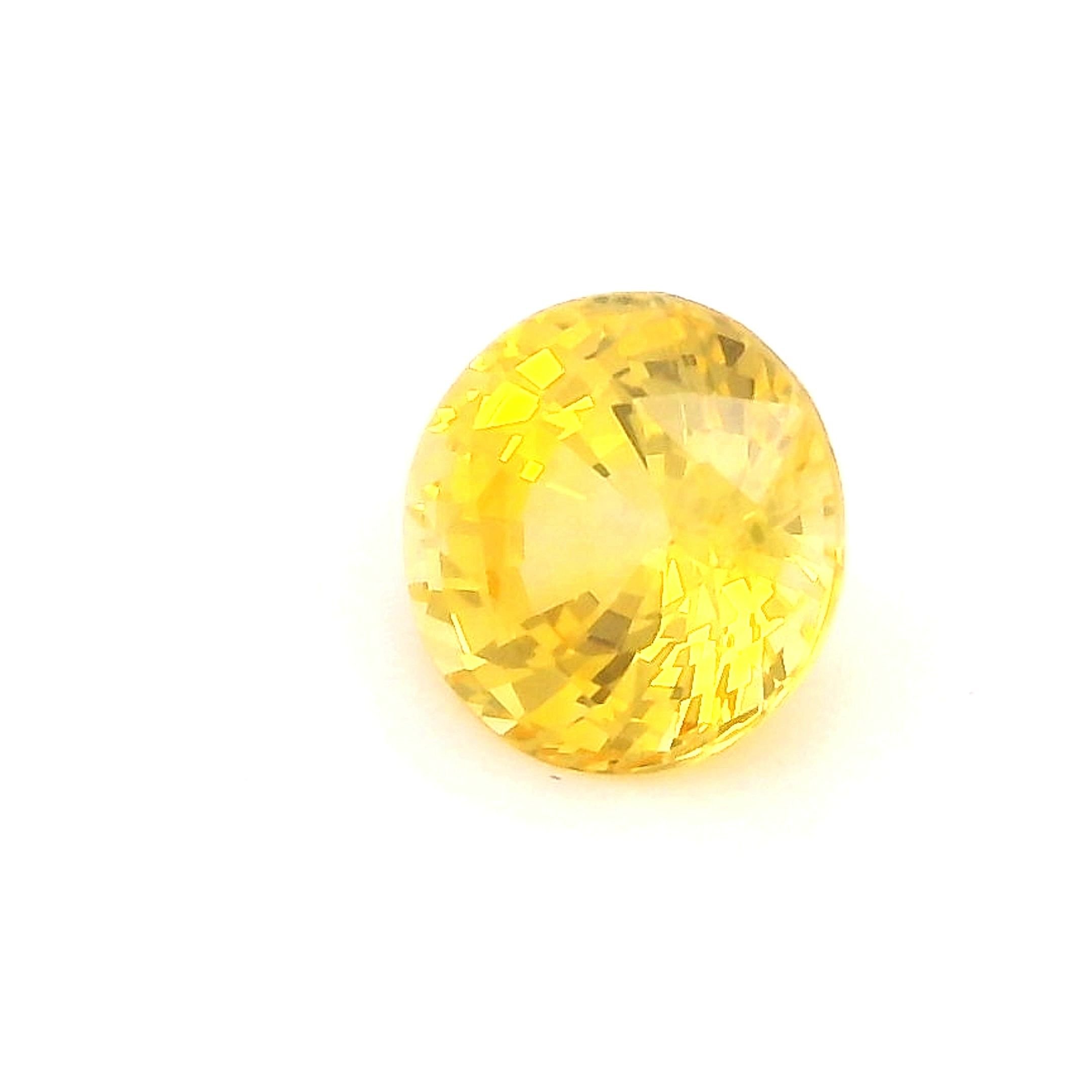 0.56 Carat Vivid Yellow Round Sapphire