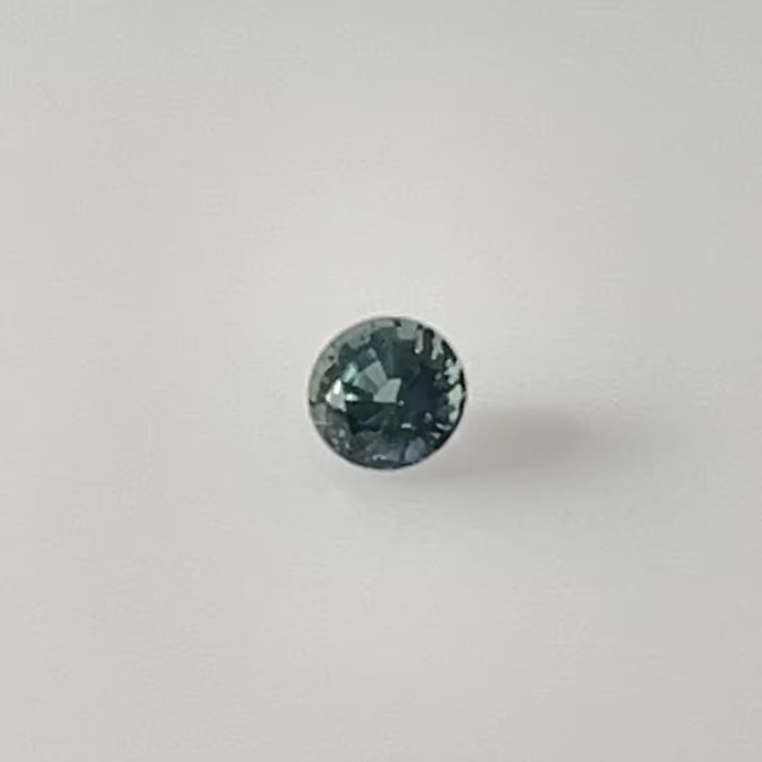 0.38 Carat Vivid Teal Round Sapphire