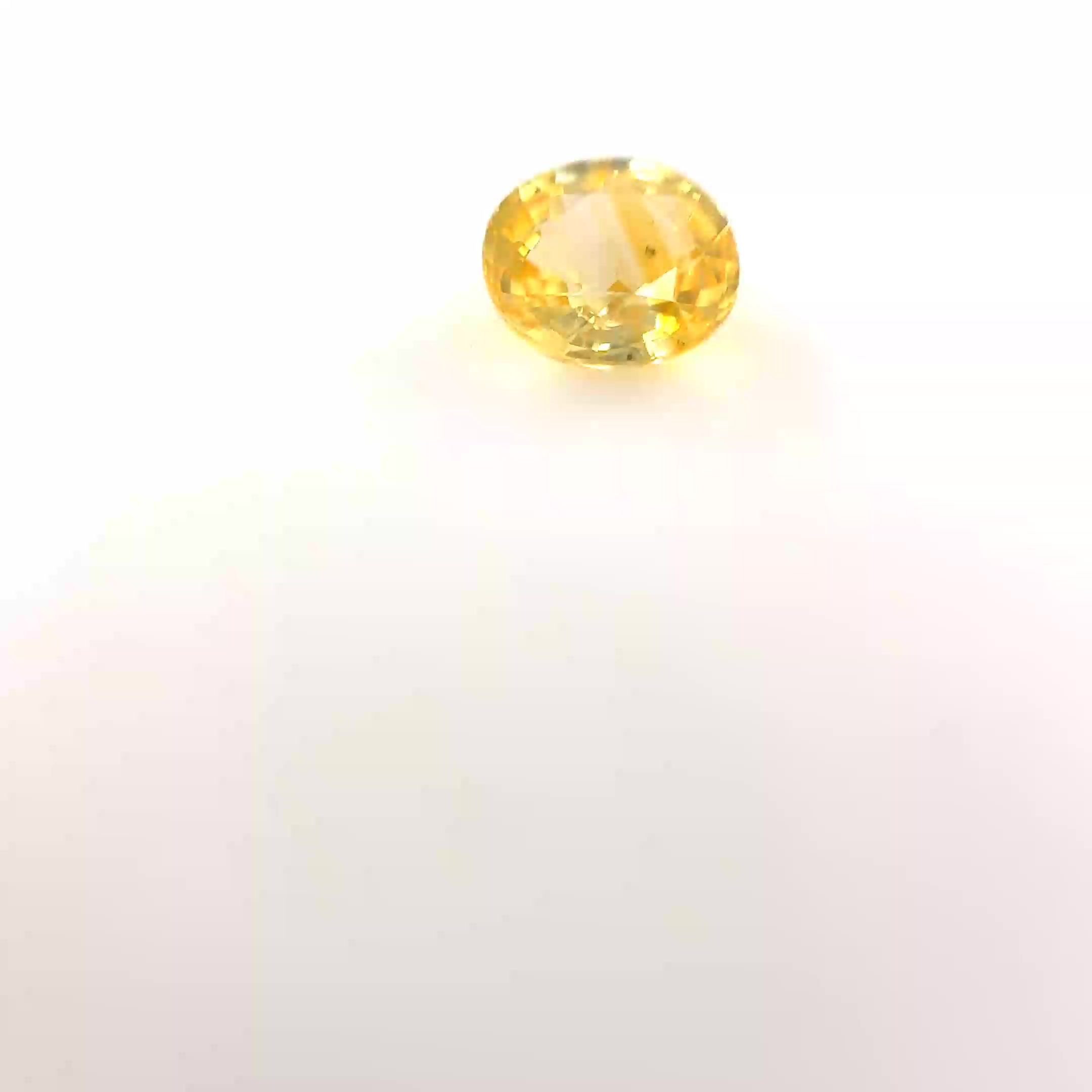 0.68 Carat Light Yellow Oval Sapphire