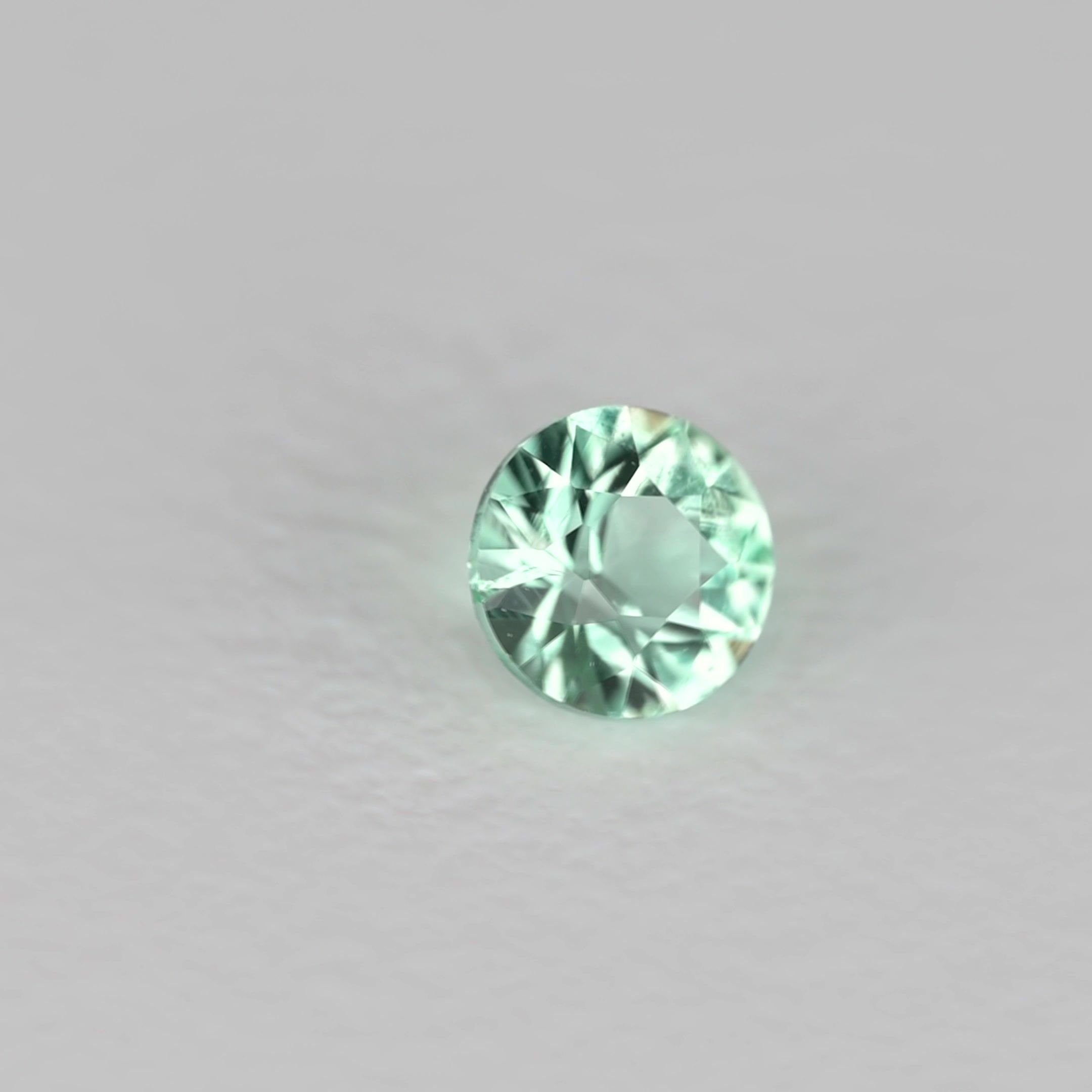 0.11 Carat Green Round Emerald