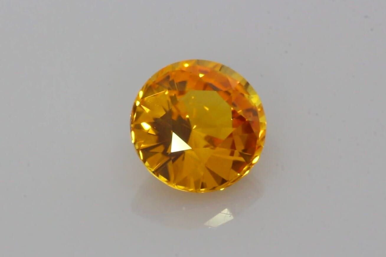 4.07 Carat Deep Orange Round Sapphire
