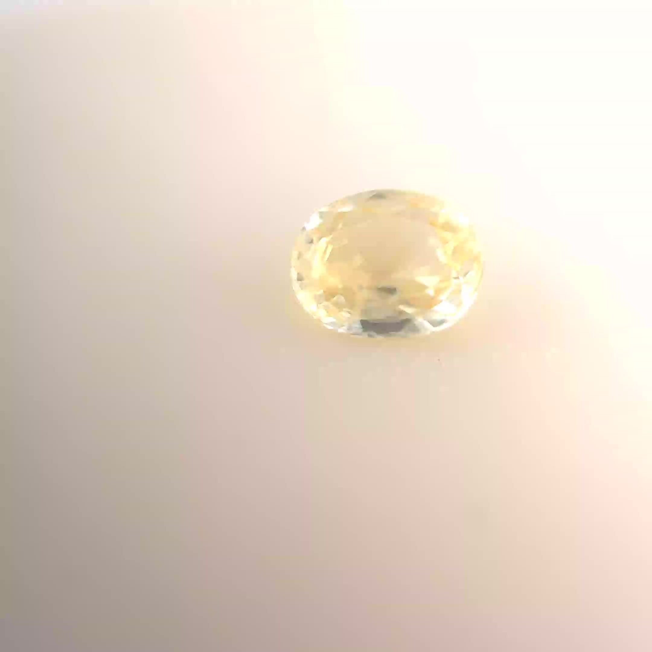 0.59 Carat Light Yellow Oval Sapphire
