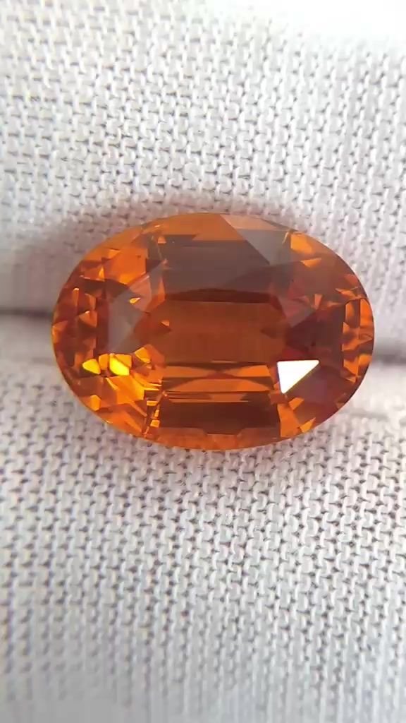 9.05 Carat Orange Oval Sapphire