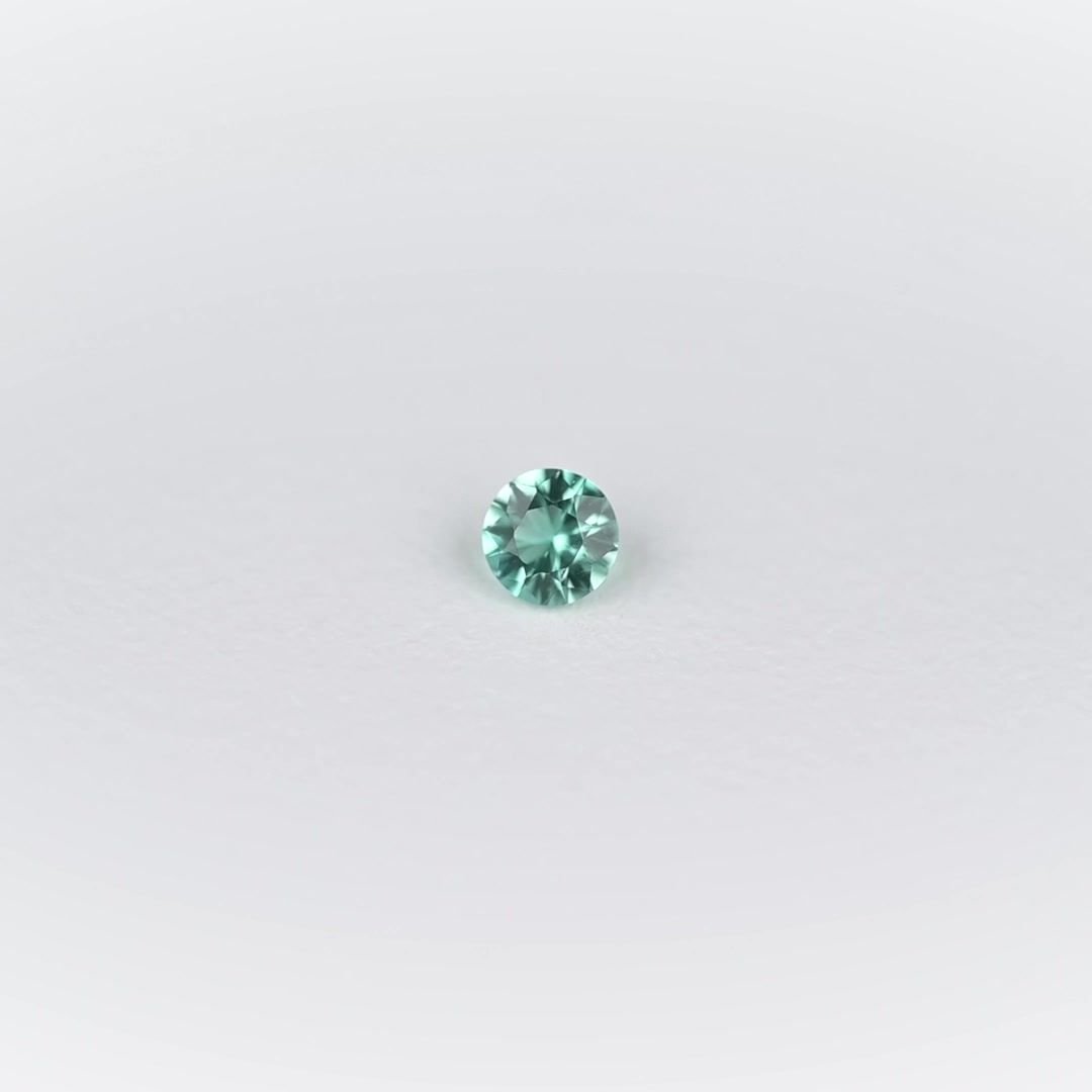 0.09 Carat Light Green Round Emerald