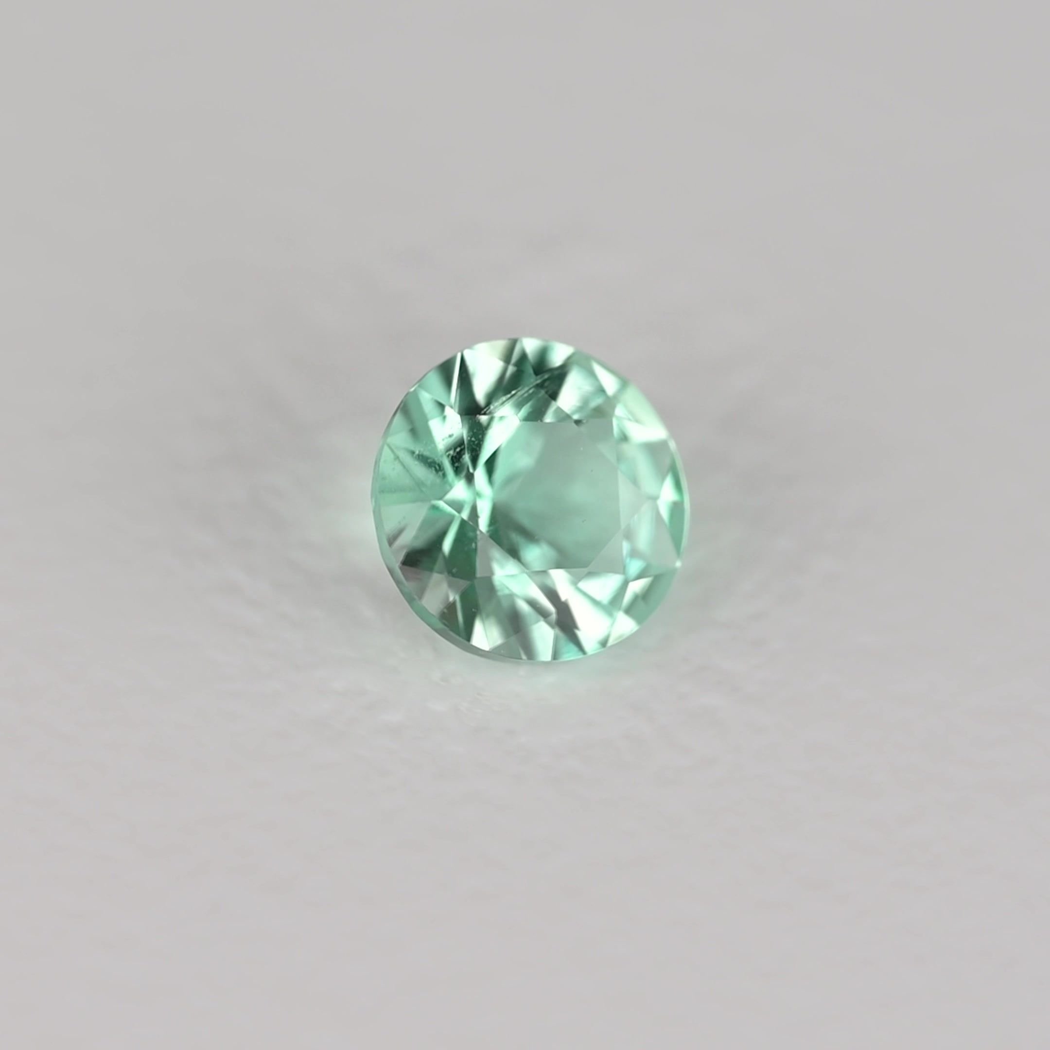 0.13 Carat Green Round Emerald