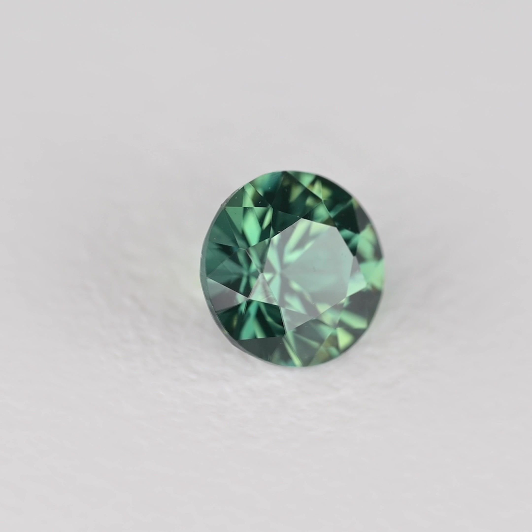 0.32 Carat Teal Round Sapphire