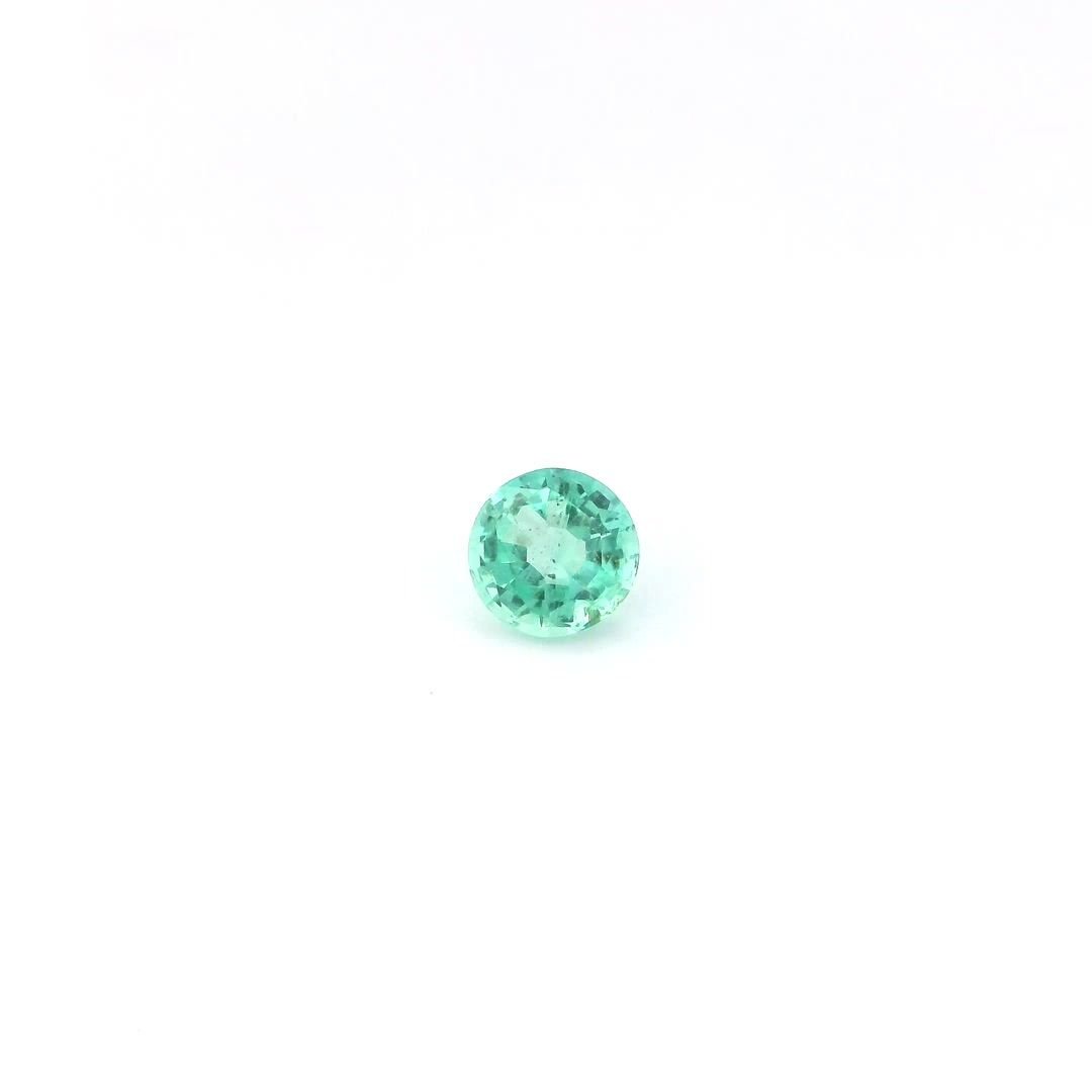 0.56 Carat Light Green Round Emerald