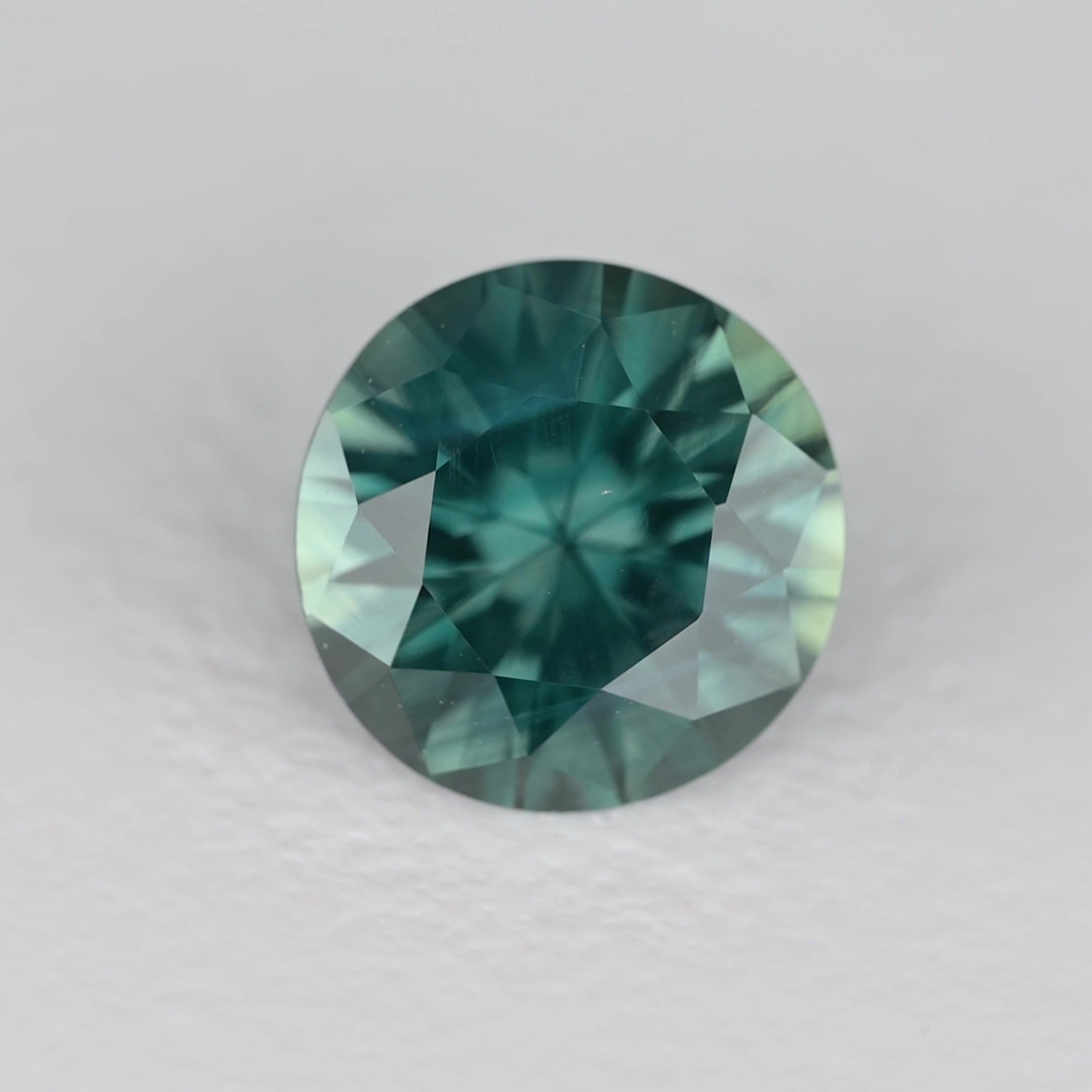 0.77 Carat Teal Round Sapphire
