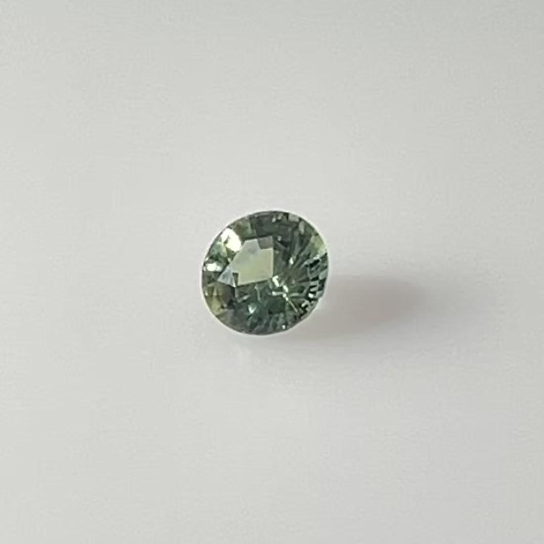 0.60 Carat Vivid Teal Round Sapphire