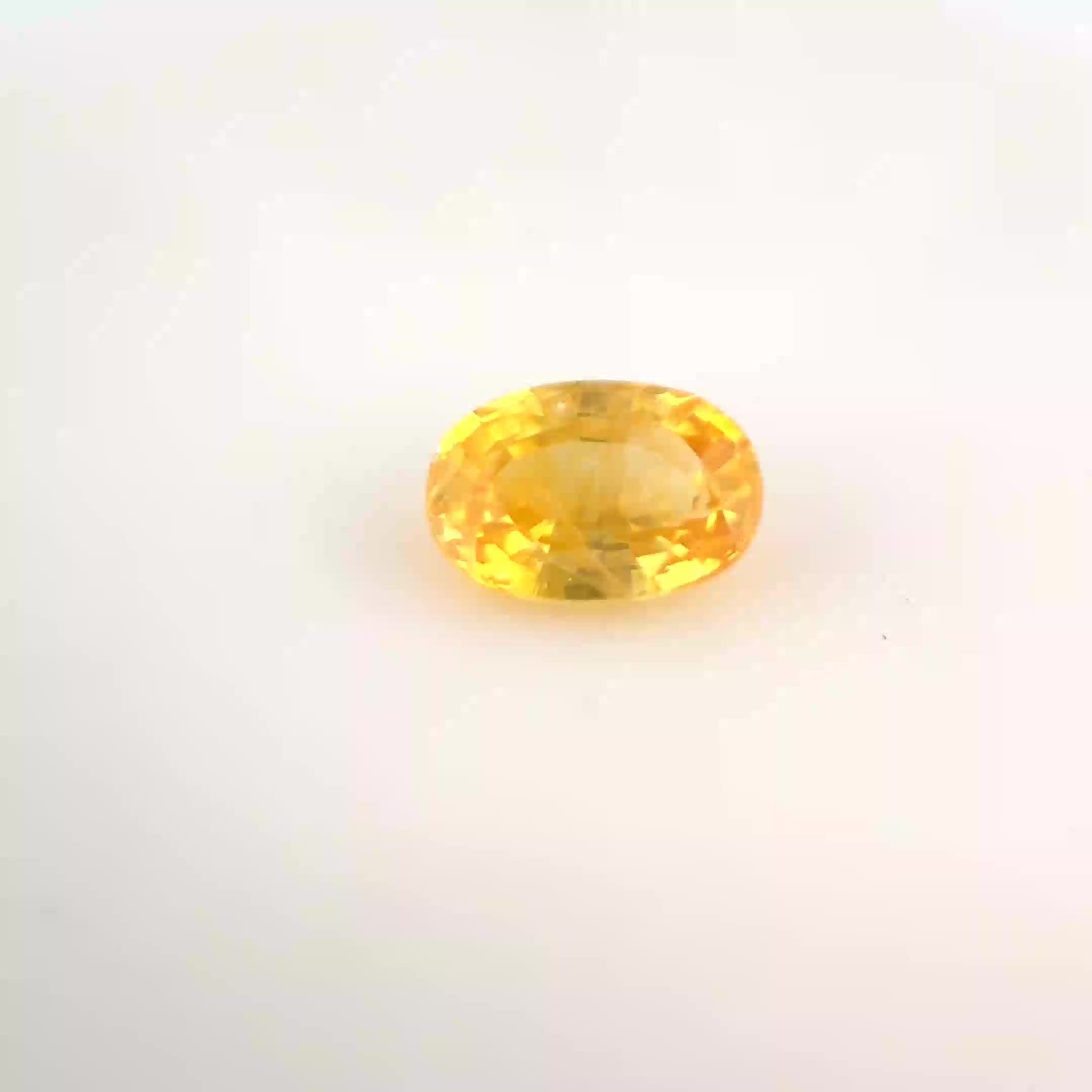 0.65 Carat Vivid Yellow Oval Sapphire