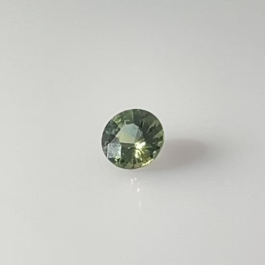 0.64 Carat Teal Round Sapphire