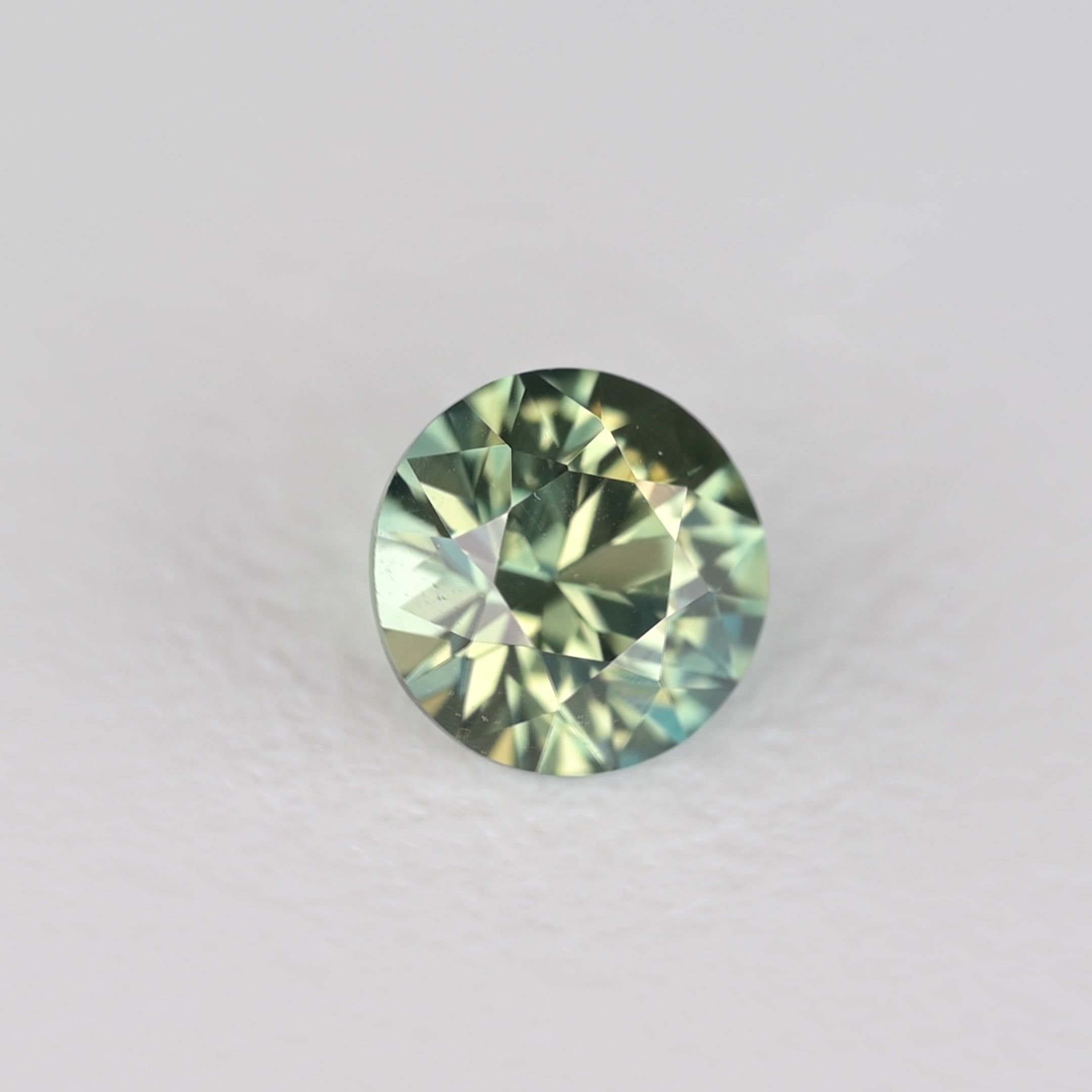 0.32 Carat Teal Round Sapphire