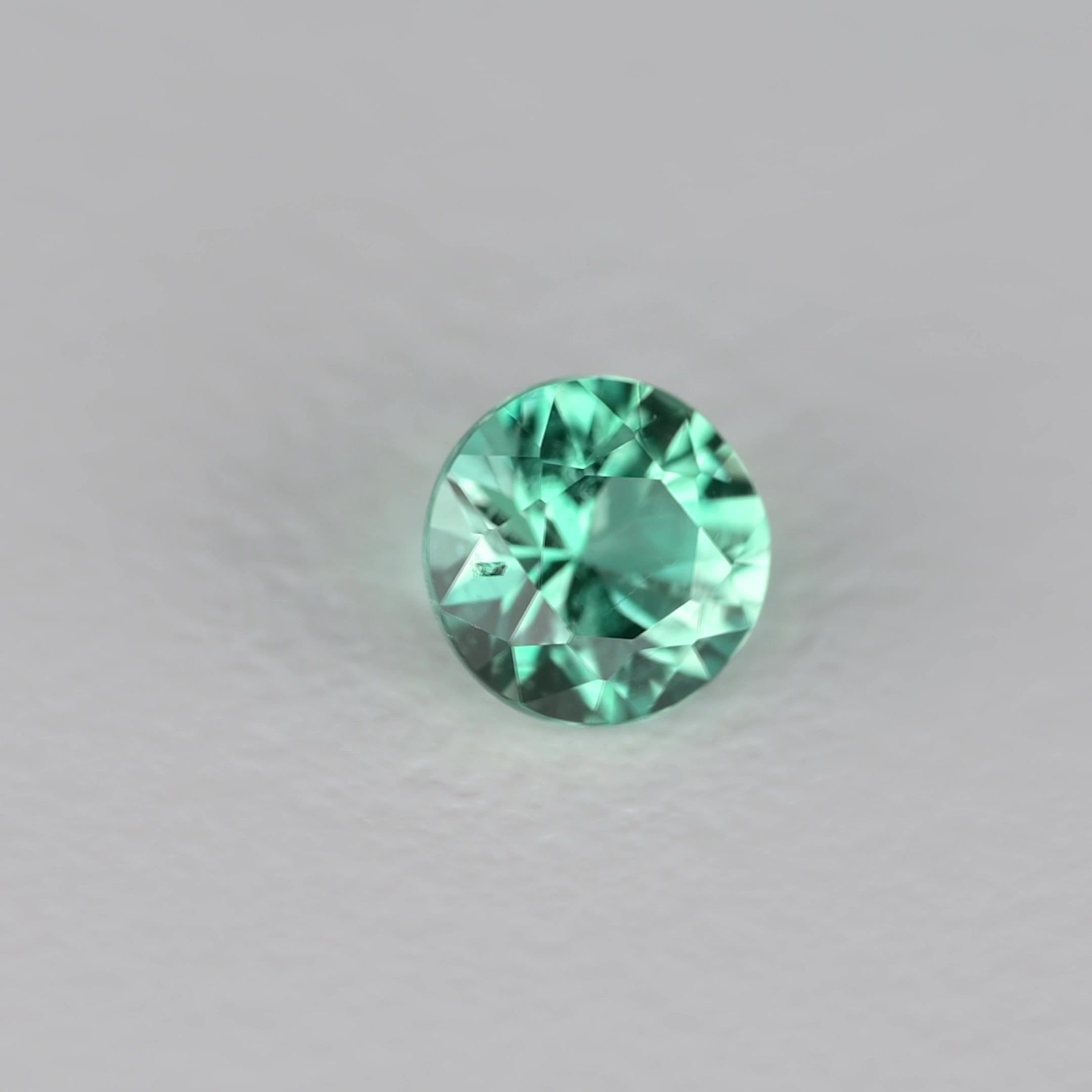 0.16 Carat Green Round Emerald