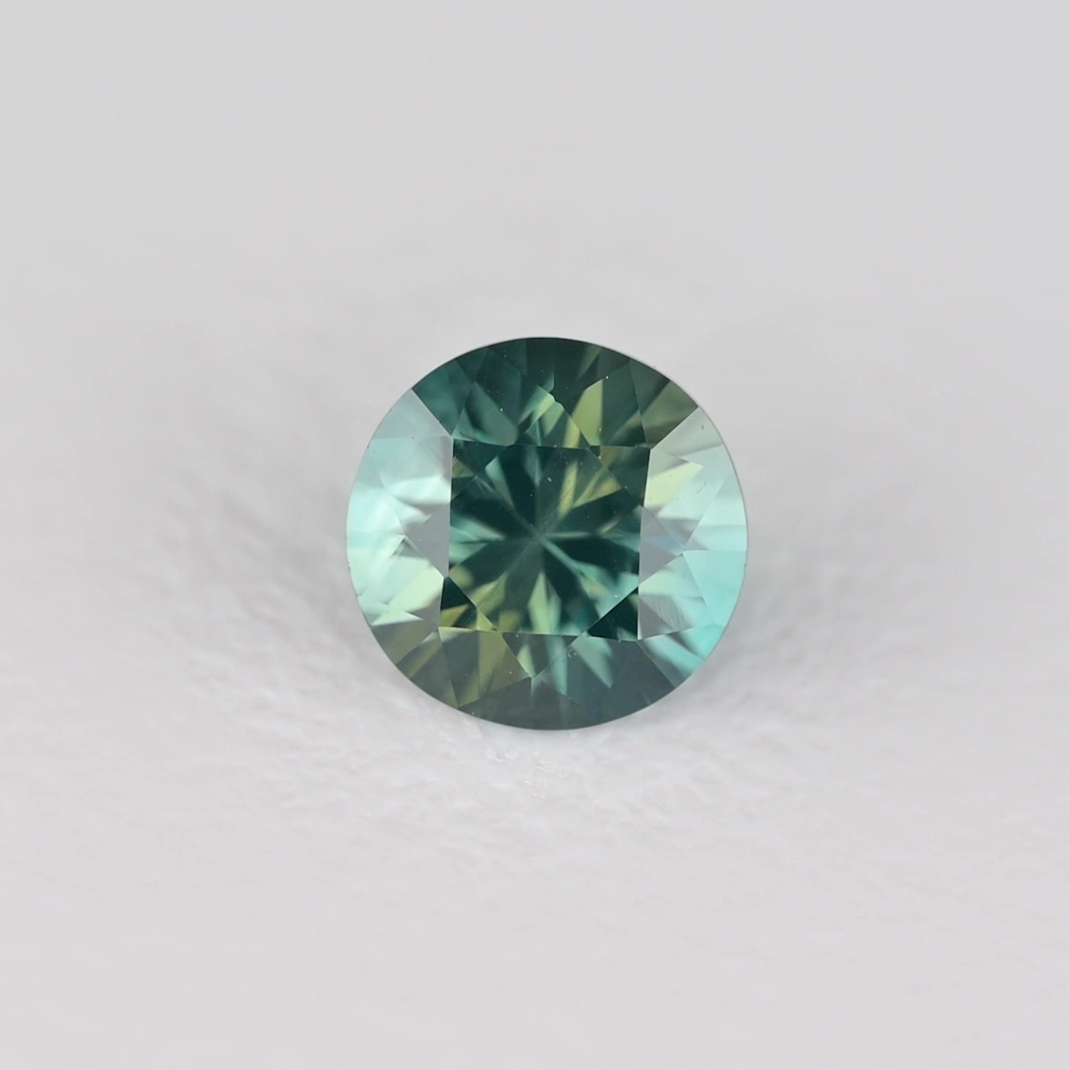 0.34 Carat Teal Round Sapphire