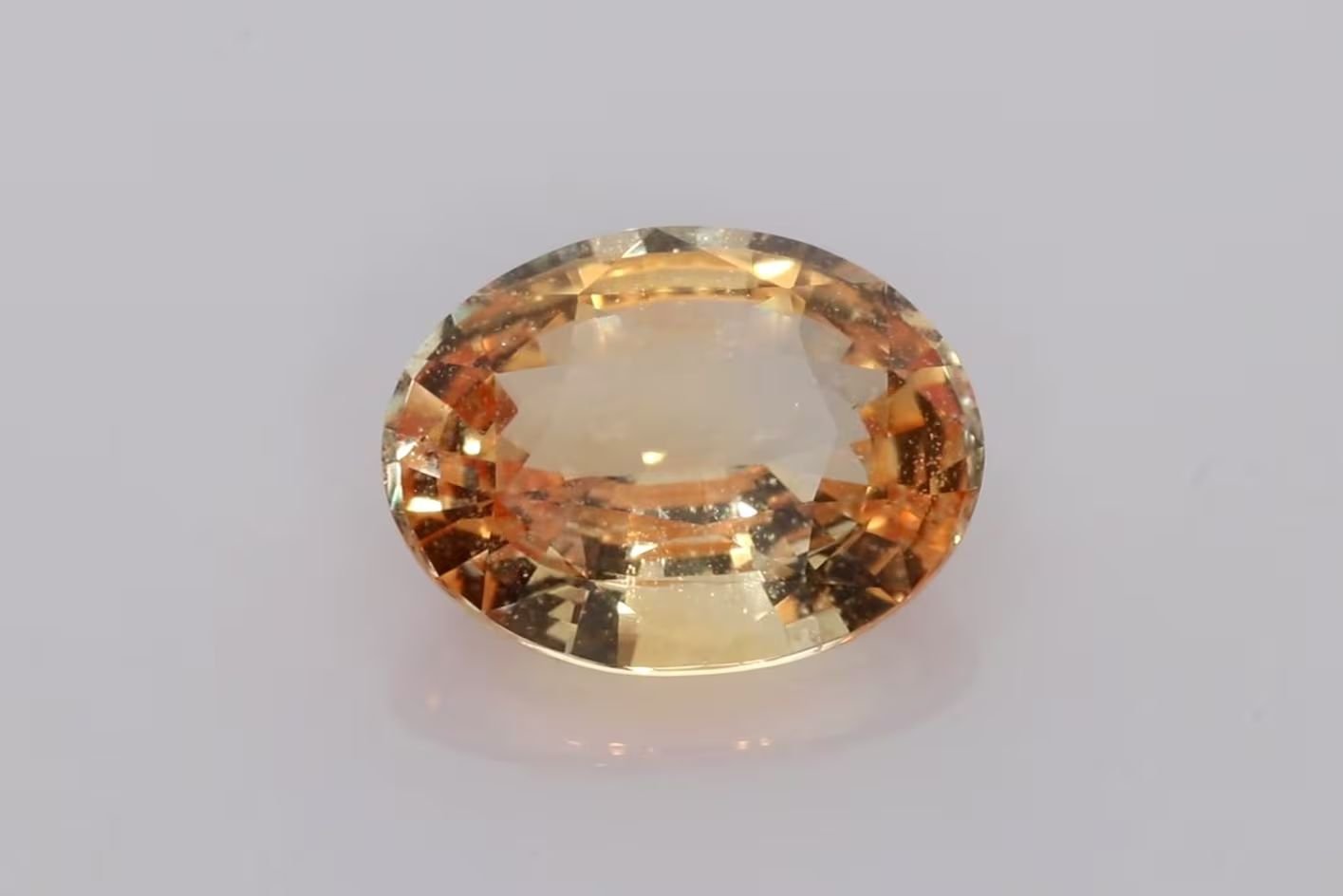 4.96 Carat Orange Oval Sapphire