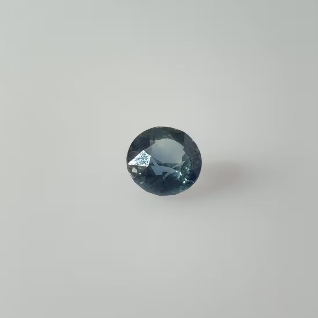 1.04 Carat Vivid Teal Round Sapphire