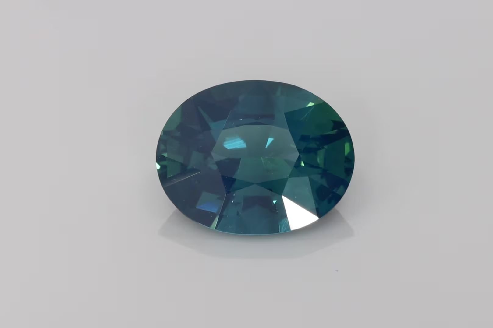 6.51 Carat Vivid Teal Oval Sapphire